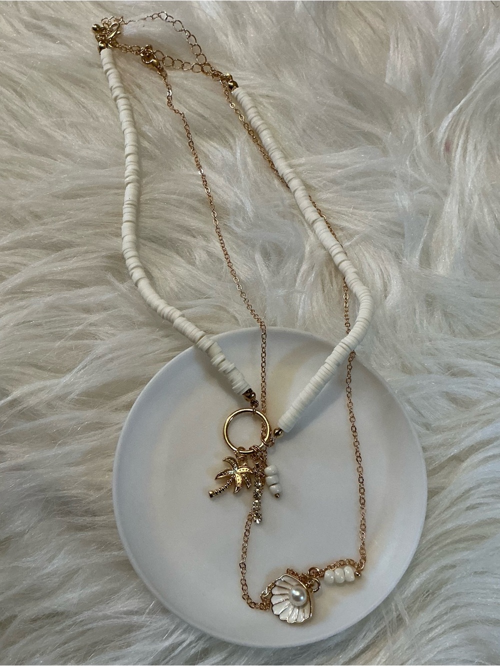 Two white/gold-tone beach/ocean shell, palm, faux pearl necklaces